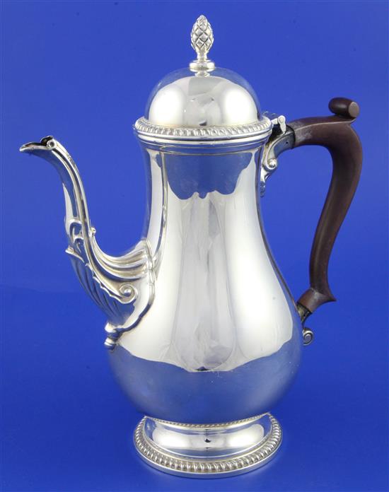 A 1960s Georgian style silver coffee pot, gross 23 oz.